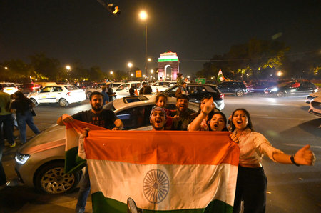 NEW DELHI INDIA MARCH 9 2025 Cricket fans celebrates India winning the ICC Champions Trophy 2025...