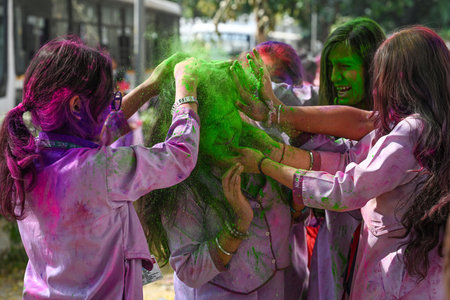 NEW DELHI INDIA MARCH 11 2025 Students play with colors ahead of Holi festival outside their school at KG Marg on March 11 2025 in New Delhi India Photo by Sanchit Khanna Hindustan Timesのeditorial素材
