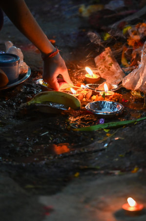 NOIDA, INDIA - MARCH 14: Hindu devotees burn Holika at Sanatan Dharma Mandir Sector 19 on Thursday night, on March 14, 2025 in Noida, India. According to Hindu scriptures, Holika Dahan, also known as Holika Deepak or Choti Holi, celebrates the victory of のeditorial素材