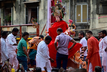 MUMBAI, INDIA - MARCH 23: On the occasion of Chaitra Navratri, the first Sarvajanik idol of the goddess Durga brought by the Raj Rajeshwari Pratishthan Nyas Mandal celebrating their 12th year, at Tardeo , on March 23, 2025 in Mumbai, India. (Photo by Anshのeditorial素材