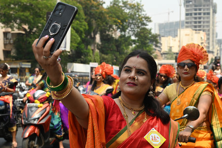 NAVI MUMBAI, INDIA - MARCH 30: People enjoying the festival of Gudi Padwa at Vashi on March 30, 2025 in Navi Mumbai, India. Gudi Padwa is a significant festival celebrated by Hindus in Maharashtra, and Yugadi in Karnataka is observed on the first day of tのeditorial素材