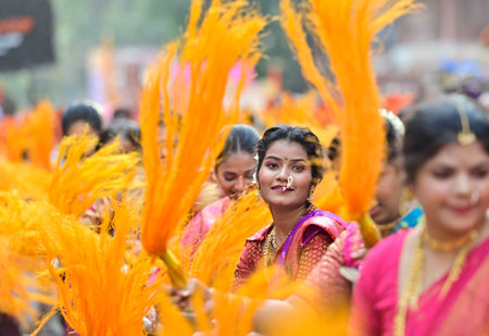 MUMBAI, INDIA - MARCH 30: Women dressed in traditional attire participate in a rally on the occasion of Gudi Padwa,at Girgoan, on March 30, 2025 in Mumbai, India. Gudi Padwa is a significant festival celebrated by Hindus in Maharashtra, and Yugadi in Karnのeditorial素材