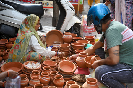 NOIDA, INDIA - MARCH 29: People shop at Sector 12 market a day before the Navratri festival, on March 29, 2025 in Noida, India. Navratri, or nine nights, is a Hindu festival celebrated twice a year in Chaitra (Marchのeditorial素材