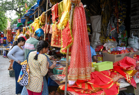 NOIDA, INDIA - MARCH 29: People shop at Sector 12 market a day before the Navratri festival, on March 29, 2025 in Noida, India. Navratri, or nine nights, is a Hindu festival celebrated twice a year in Chaitra (Marchのeditorial素材