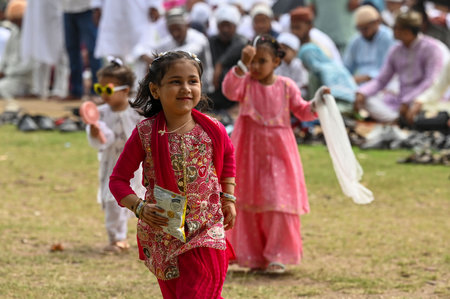 KOLKATA, INDIA - MARCH 31: Kids enjoy playing before the special morning prayer (namaz) on the occasion of Eid al-Fitr festival to marks the the end of Holy fasting month of Ramadan on Red Road on March 31, 2025 in Kolkata, India. Muslims around the worldのeditorial素材