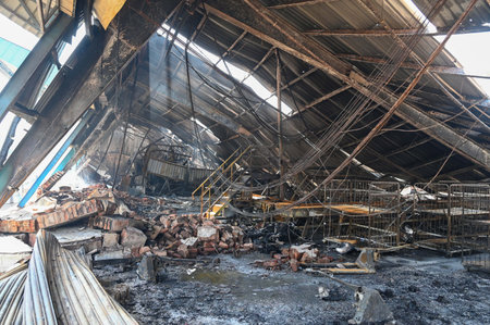 GURUGRAM, INDIA - APRIL 2: Fire service personnel are working to douse the fire that broke out at a factory warehouse and a beverage godown in Kadipur Industrial Area near Radha Soami Satsang Bhawan on Pataudi Road, on April 2, 2025 in Gurugram, India. Thのeditorial素材