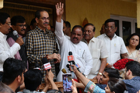 MUMBAI INDIA APRIL 8 2025 Congress leader Sahadev Petkar from Ratnagiri with Shiv Sena UBT chief Uddhav Thackeray after joining the party outside Matoshree in Bandra on April 8 2025 in Mumbai India Photo by Satish Bate Hindustan Timesのeditorial素材