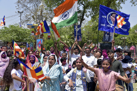 GHAZIABAD INDIA APRIL 14 2025 Women dancing and singing while paying tribute at the statue of Bharat Ratna Babasaheb BR Ambedkar on his birth anniversary at Ambedkar park statue in Navyug market on April 14 2025 in Ghaziabad India Photo by Sakib Ali Hinduのeditorial素材