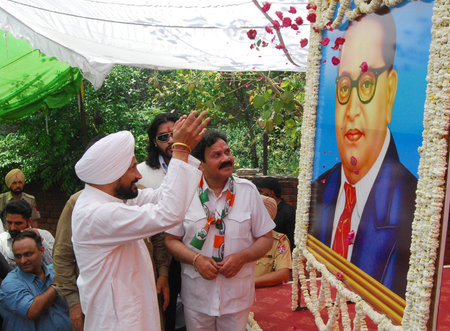 AMRITSAR INDIA APRIL 14 2025 Former Punjab CM Congress MP Charanjit Singh Channi paying tribute to BR Ambedkar during Samvidhan Bachao rally to mark the birth anniversary of Bharat Ratna Babasaheb Bhimrao Ambedkar on April 14 2025 in Amritsar India Photo のeditorial素材