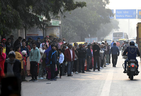 NEW DELHI, INDIA â€“ JANUARY 2: Passengers waiting for DTC bus at Nehru Place, as a lack in bus...