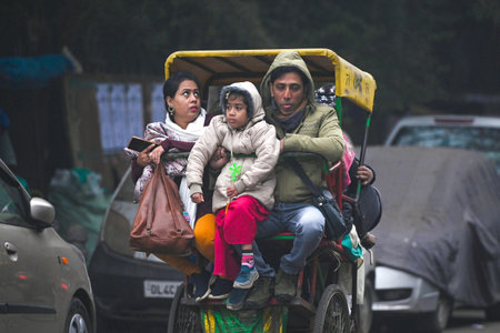NEW DELHI, INDIA - JANUARY 4: Commuters out on cold and foggy morning at Jama Masjid, on January 4, 2024 in New Delhi, India. According to IMD, Delhi NCR is likely to see extreme cold in the next next few days with minimum temperature touching 7 degree Ceのeditorial素材