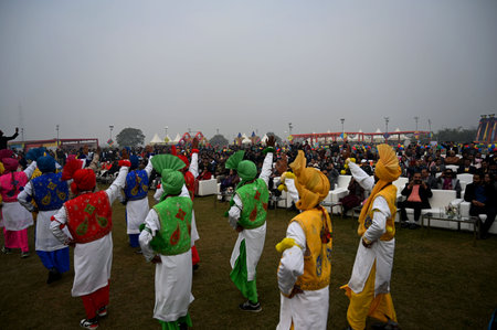 NEW DELHI, INDIA â€“ JANUARY 13: People flying kites during the first international kite...