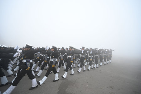 NEW DELHI, INDIA â JANUARY 14: Amid zero visibility thick fog blankets, Indian coast guard personnel rehearse for the upcoming Republic Day parade, at Vijay Chowk, on January 14, 2024 in New Delhi, India. Foggy morning challenges Delhi-NCR with intensifのeditorial素材