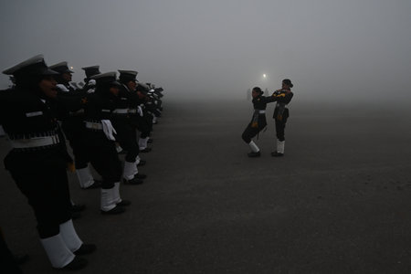 NEW DELHI, INDIA â JANUARY 14: Amid zero visibility thick fog blankets, Indian coast guard personnel rehearse for the upcoming Republic Day parade, at Vijay Chowk, on January 14, 2024 in New Delhi, India. Foggy morning challenges Delhi-NCR with intensifのeditorial素材