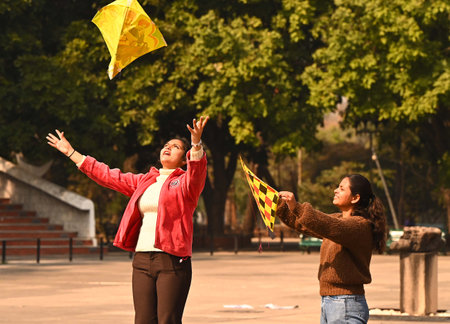 CHANDIGARH, INDIA -FEBRUARY 14: Girls enjoying a kite during Basant Panchmi celebration at Sector 10, on February 14, 2024 in Chandigarh, India. (Photo by Keshav Singh/Hindustan Times )のeditorial素材
