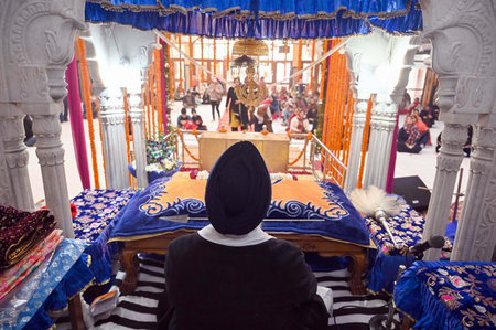 GURUGRAM, INDIA - JANUARY 17:  People praying at Gurdwara Sahib during the celebration of Guru Gobind Singh Prakash Parv of the last Sikh Guru, in New Colony near Police Chowki on January 17, 2024 in Gurugram, India. (Photo by Parveen Kumar/Hindustna Timeのeditorial素材