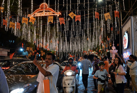 MUMBAI, INDIA - JANUARY 22: People take their selfie outside Ambani's house Antilia, which is illuminated on occasion of Lord Shri Ram Temple inauguration by PM Narendra Modi at Ayodhya, at Malabar Hills  on January 22, 2024 in Mumbai, India.  (Photo by Aのeditorial素材
