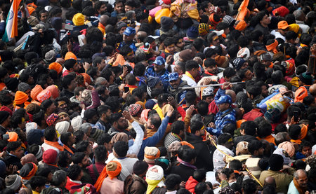 AYODHYA, INDIA - JANUARY 23: Thousands of devotees gathered for darshan at Ayodhya Ram Janmabhoomi temple, the Police force is having to struggle to control the crowd  on January 23, 2024 in Ayodhya, India. Devotees are celebrating the consecration ceremoのeditorial素材