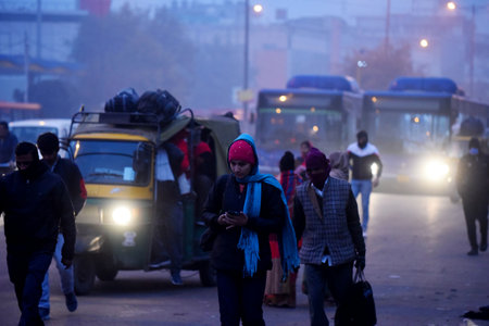 NEW DELHI, INDIA - JANUARY 29: People are seen wearing warm clothes while going to work at South West Delhi, near Kapashera Bus Stand on January 29, 2024 in New Delhi, India. (Photo by Parveen Kumar/Hindustan Times )のeditorial素材