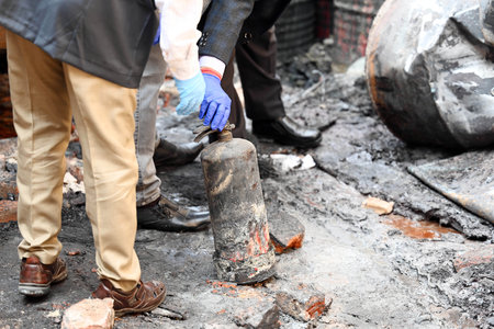 NEW DELHI, INDIA - FEBRUARY 16: FSL team at the site of a paint godown that caught fire last night, resulting in the death of 11 people  on February 16, 2024 in New Delhi, India.(Photo by Raj K Raj/Hindustan Times)のeditorial素材