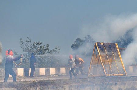 CHANDIGARH, INDIA -FEBRUARY 14: Haryana Police fired Tear gas shells to stop protesters to came near the barricades during the Farmers Protest at Shambu Border of Punjab and Haryana near Ambala, on February 14, 2024 in Chandigarh, India. Police deployed tのeditorial素材