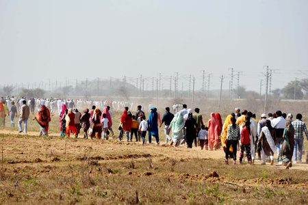 REWARI, INDIA - FEBRUARY 16:  Thousands of people arrives to listen Prime Minister Narendra Modi speech during the inaugurates lays foundation stone of countrys 22nd All India Institute Of Medical Sciences(AIIMS) and other projects  at Majra Bhalkhi on Feのeditorial素材