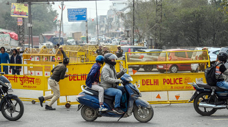 NEW DELHI, INDIA - FEBRUARY 12: Delhi Police and Security forces officials preparing security arrangements at Sanjay Gandhi Transport Nagar, ahead of the farmers call for March to Delhi on 13th February,  on February 12, 2024 in New Delhi, India. Farmers のeditorial素材