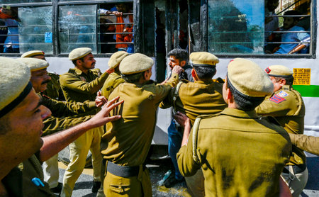 NEW DELHI, INDIA - MARCH 5:  Delhi Police and Paramilitary Security forces try to detaining Akhil Bharatiya Vidyarthi Parishad (ABVP) activists during the demonstration against Mamata Banerjee's government to demand justice for women who have fallen victiのeditorial素材