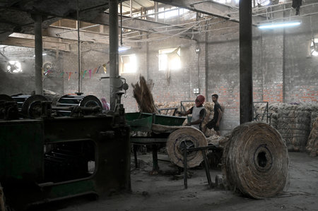 KOLKATA, INDIA - FEBRUARY 27: Labourers work at factory section while a fire broke out at godown of Calcutta Jute Mill on February 27, 2024 in Kolkata, India. 10 fire engine rushed to the spot and no casualties reported. (Photo by Samir Jana/Hindustan Timのeditorial素材