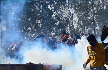 AMBALA, INDIA - FEBRUARY 21: Police action on agitated farmers at Shambhu Border of Punjab and Haryana onFebruary 21, 2024 near Ambala, India. The situation at the Punjab-Haryanas Shambhu and Khanauri state border points turned intense after a clash betweのeditorial素材
