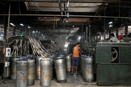 KOLKATA, INDIA - FEBRUARY 27: Labourers work at factory section while a fire broke out at godown of Calcutta Jute Mill on February 27, 2024 in Kolkata, India. 10 fire engine rushed to the spot and no casualties reported. (Photo by Samir Jana/Hindustan Timのeditorial素材