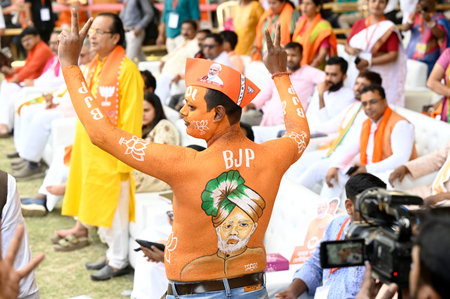 NORTH 24 PARGANAS, INDIA - MARCH 6:   A Bharatiya Janata Party (BJP) supporter paints his body...