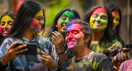 NEW DELHI, INDIA - MARCH 21: Students play with colours ahead of Holi festival, at outside the Matasundari College, ITO on March 21, 2024 in New Delhi, India.(Photo by Raj K Raj/Hindustan Times)のeditorial素材