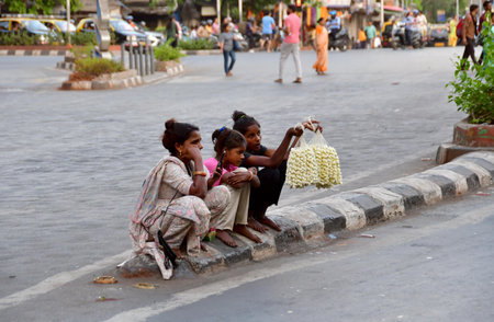 MUMBAI, INDIA - APRIL 7: A girl selling flowers on the road side, at Tardeo on April 7, 2024 in Mumbai, India. (Photo by Bhushan Koyande/Hindustan Times )のeditorial素材