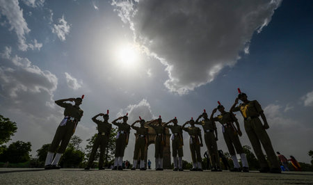 NEW DELHI, INDIA - APRIL 20: Silhouette of NCC Students saluting the Bose Statue under the Clouds on a hot afternoon on Kartavya Path on April 20, 2024 in New Delhi, India. (Photo by Raj K Raj/Hindustan Times )のeditorial素材
