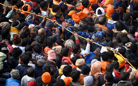 AYODHYA, INDIA - JANUARY 23: Thousands of devotees gathered for darshan at Ayodhya Ram Janmabhoomi temple, the Police force is having to struggle to control the crowd  on January 23, 2024 in Ayodhya, India. Devotees are celebrating the consecration ceremoのeditorial素材
