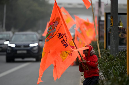 NEW DELHI, INDIA â€“ JANUARY 20: A street vendor sells flags of Ram Mandir at Akshardham Temple...