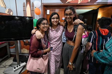 NEW DELHI, INDIA - AUGUST 23:  People celebrates after successful landing of Chandrayaan 3 on Moon at Nehru Planetarium  on August 23, 2023 in New Delhi, India.  The Chandrayaan-3 lander module has successfully touched down on the Moon's south pole, makinのeditorial素材
