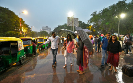 NEW DELHI, INDIA â APRIL 30: Commuters out in the rain at Connaught Place, on April 30, 2023 in New Delhi, India. (Photo by Sanjeev Verma/Hindustan Times )のeditorial素材