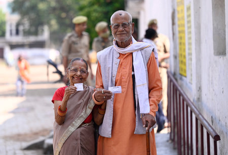 LUCKNOW, INDIA - MAY 4: An elderly couple show Voter cards, exiting the booth after casting their vote during the local bodies election at Chinhat polling booth on May 4, 2023 in Lucknow, India. (Photo by Deepak Gupta/Hindustan Times)のeditorial素材