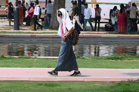 NEW DELHI, INDIA â€“ MAY 14: Visitors at Kartavya Path Lawns in hot Weather, on May 14, 2023 in...