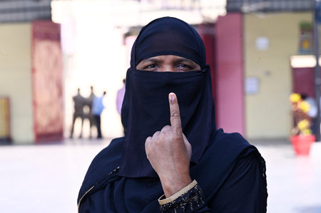 LUCKNOW, INDIA - MAY 4: Muslim voter shows inked finger, exiting the booth after casting her vote during the local bodies election at Rani Laxmi Bhai Memorial School Chinhat block on May 4, 2023 in Lucknow, India. (Photo by Deepak Gupta/Hindustan Times)のeditorial素材