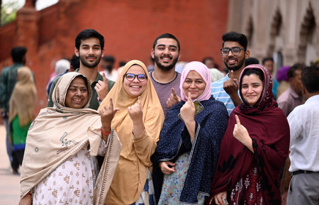 LUCKNOW, INDIA - MAY 4: A family of old city area show inked fingers, exiting the booth after casting their vote during the local bodies election at the picture gallery polling booth of Hussinabad area on May 4, 2023 in Lucknow, India. (Photo by Deepak Guのeditorial素材