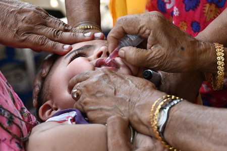 KOLKATA, INDIA â€“ MAY 28: A health worker administered Pulse Polio drops to a child, on May...