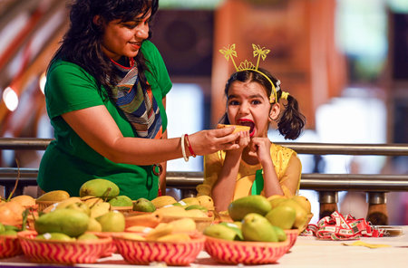 NEW DELHI, INDIA - JUNE 7:  People relish different varieties of mango' during the inauguration of '32nd Mango Festival' at Dill Haat in New Delhi, India, on Friday, July 7, 2023. (Photo by Raj K Raj/Hindustan Times)のeditorial素材
