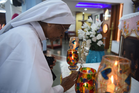 NAVI MUMBAI, INDIA - JULY 19: Devotees welcome visitation of the Pilgrim Relic ofPope John Paul II at St. Little Flower church, Nerul on July 19, 2023 in Navi Mumbai, India. A relic of Pope John Paul II, a portion of a wooden cross, is on a five-day tour のeditorial素材