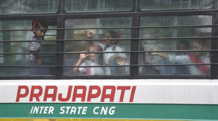 NEW DELHI, INDIA - JULY 18: School Students during rain after schools reopen five days in the...