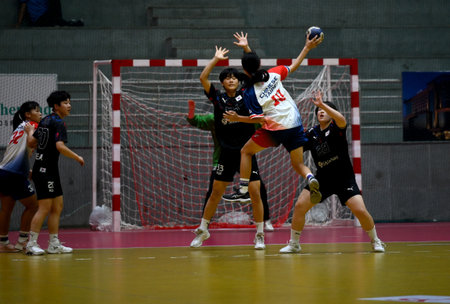 NOIDA, INDIA â JULY 22: The 10th Asian Women's Youth (U18) Handball Championship match is currently underway at Noida Stadium, featuring an intense face-off between South Korea and Chinese Taipei, on July 22, 2023 in Noida, India. This thrilling match sのeditorial素材