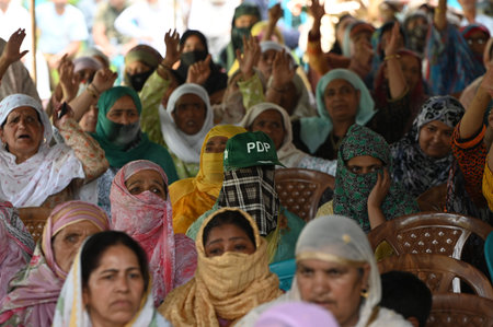 SRINAGAR, INDIA - JULY 31: Supporters of Peoples Democratic Party (PDP) listen to Party President Mehbooba Mufti during an event on the 24th raising day of the PDP, at Sher-e-Kashmir Park on July 31, 2023 in Srinagar, India. (Photo by Waseem Andrabi/Hinduのeditorial素材