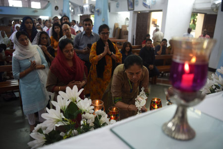 NAVI MUMBAI, INDIA - JULY 19: Devotees welcome visitation of the Pilgrim Relic ofPope John Paul II at St. Little Flower church, Nerul on July 19, 2023 in Navi Mumbai, India. A relic of Pope John Paul II, a portion of a wooden cross, is on a five-day tour のeditorial素材